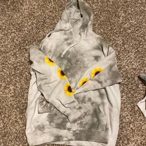 Tie dye, gray hoodie with sunflowers on the sleeves